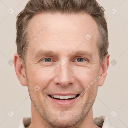 Joyful white adult male with short  brown hair and grey eyes