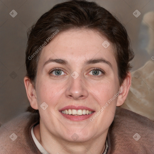 Joyful white adult female with medium  brown hair and blue eyes