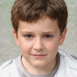 Joyful white child male with short  brown hair and brown eyes