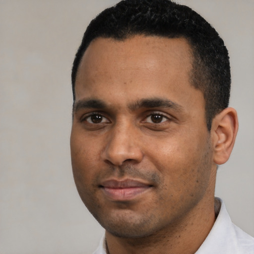 Neutral black young-adult male with short  black hair and brown eyes