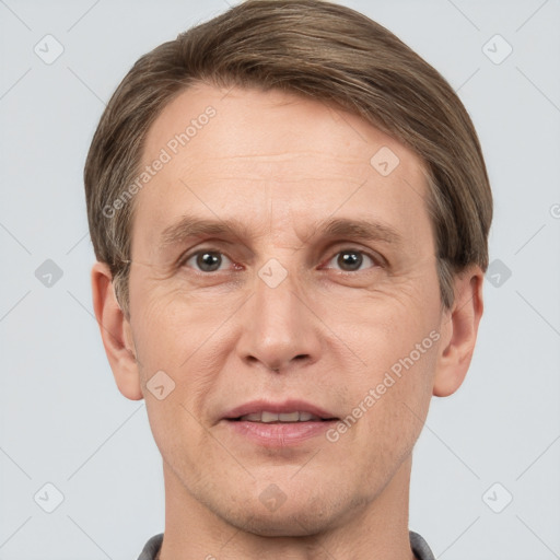 Joyful white adult male with short  brown hair and grey eyes