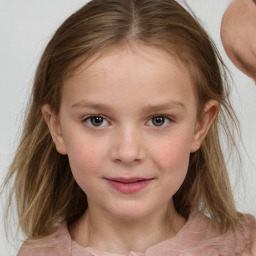 Joyful white child female with medium  brown hair and grey eyes