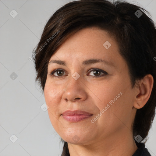 Joyful white adult female with medium  brown hair and brown eyes