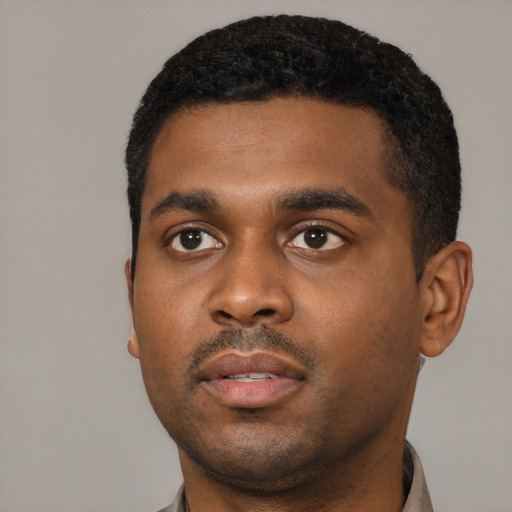 Neutral black young-adult male with short  black hair and brown eyes