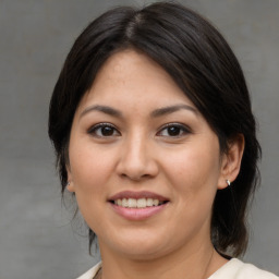 Joyful asian young-adult female with medium  brown hair and brown eyes