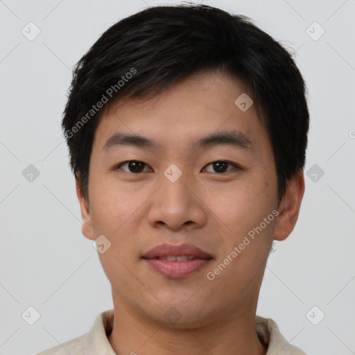 Joyful asian young-adult male with short  black hair and brown eyes