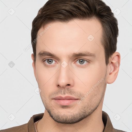 Neutral white young-adult male with short  brown hair and brown eyes