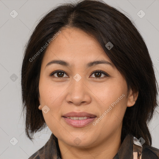 Joyful asian adult female with medium  brown hair and brown eyes