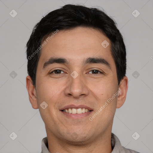 Joyful white young-adult male with short  black hair and brown eyes