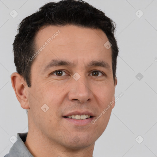 Joyful white adult male with short  brown hair and brown eyes