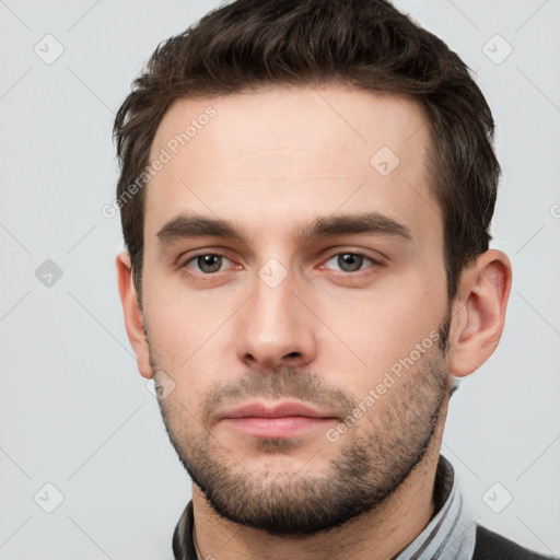 Neutral white young-adult male with short  brown hair and brown eyes