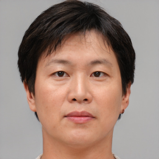 Neutral asian adult male with short  brown hair and brown eyes