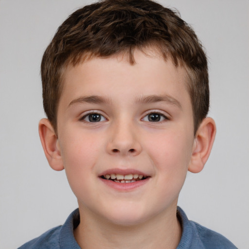 Joyful white child male with short  brown hair and brown eyes