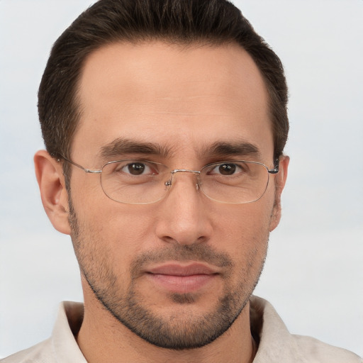 Joyful white adult male with short  brown hair and brown eyes