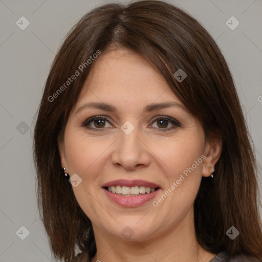 Joyful white adult female with medium  brown hair and brown eyes