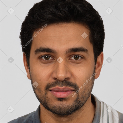 Joyful latino young-adult male with short  black hair and brown eyes