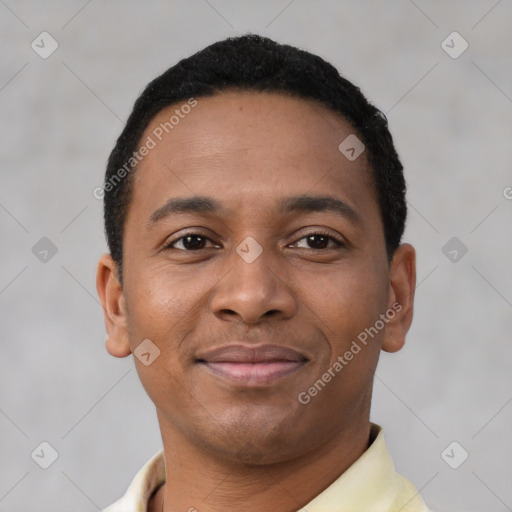 Joyful latino young-adult male with short  brown hair and brown eyes