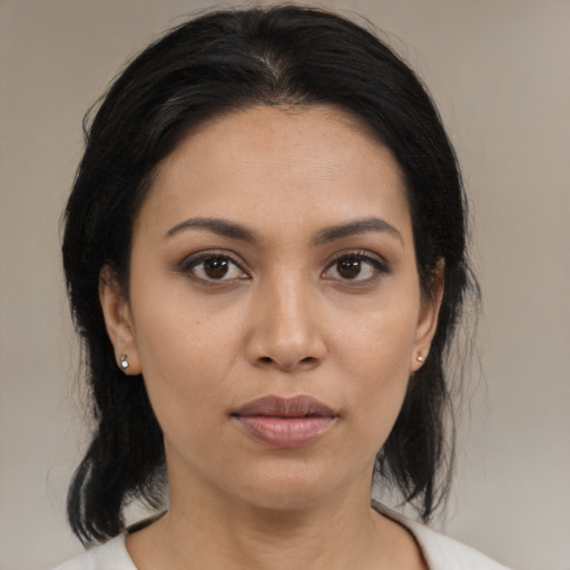 Joyful asian young-adult female with medium  black hair and brown eyes