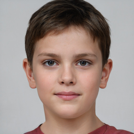 Joyful white child male with short  brown hair and grey eyes