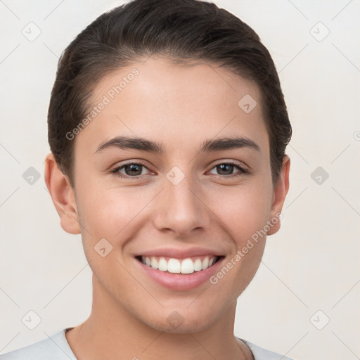 Joyful white young-adult female with short  brown hair and brown eyes