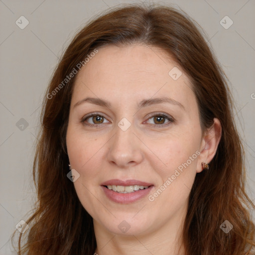 Joyful white adult female with long  brown hair and brown eyes