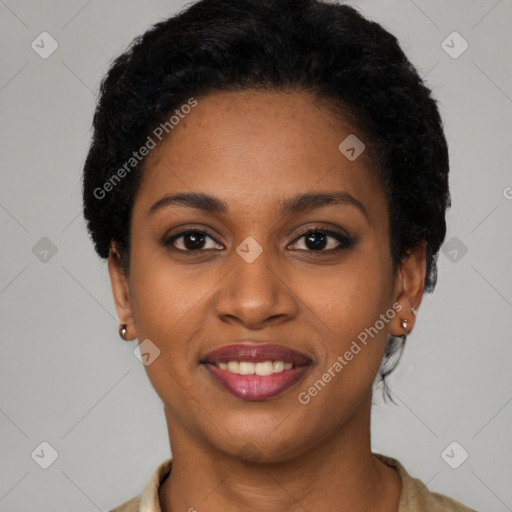 Joyful black young-adult female with short  brown hair and brown eyes