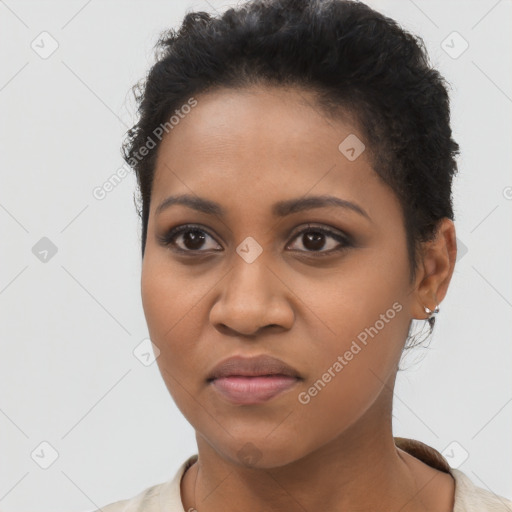 Joyful black young-adult female with short  brown hair and brown eyes