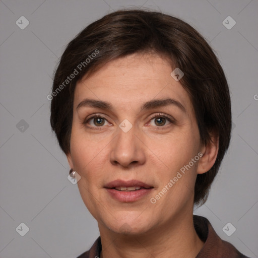 Joyful white adult female with medium  brown hair and grey eyes