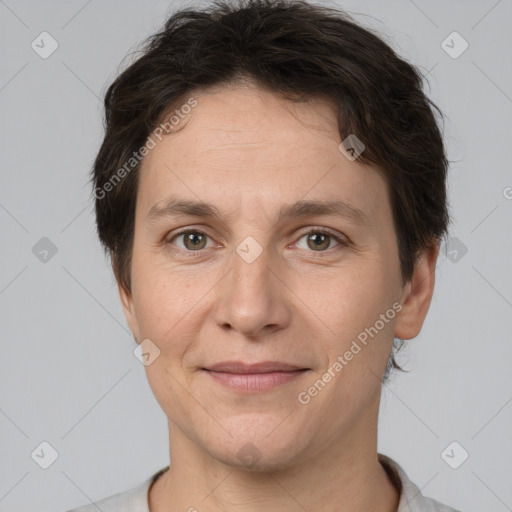 Joyful white adult female with short  brown hair and brown eyes