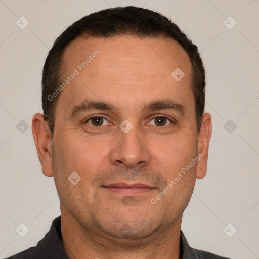 Joyful white adult male with short  brown hair and brown eyes