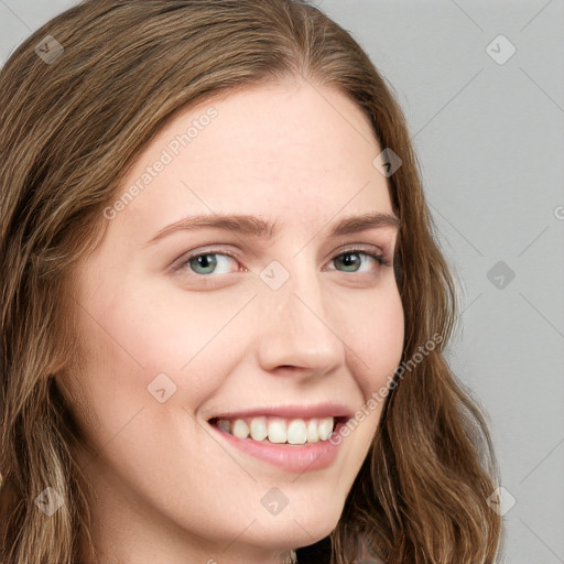 Joyful white young-adult female with long  brown hair and blue eyes