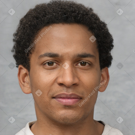 Joyful black young-adult male with short  brown hair and brown eyes