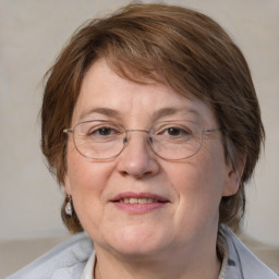 Joyful white middle-aged female with medium  brown hair and brown eyes