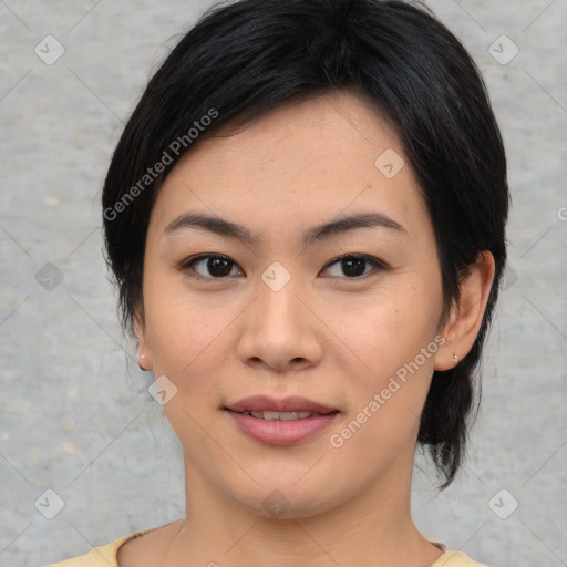 Joyful asian young-adult female with medium  black hair and brown eyes