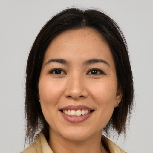 Joyful white young-adult female with medium  brown hair and brown eyes