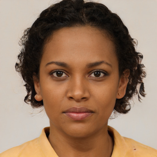 Neutral black young-adult female with short  brown hair and brown eyes