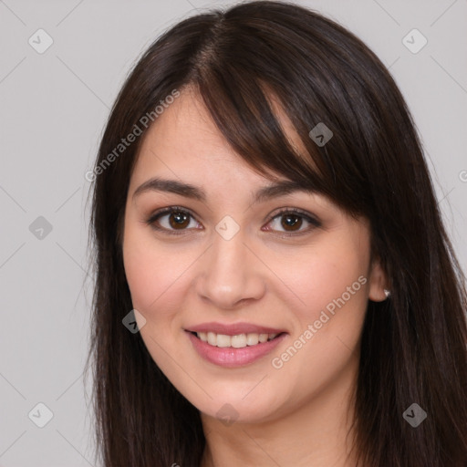 Joyful white young-adult female with long  brown hair and brown eyes