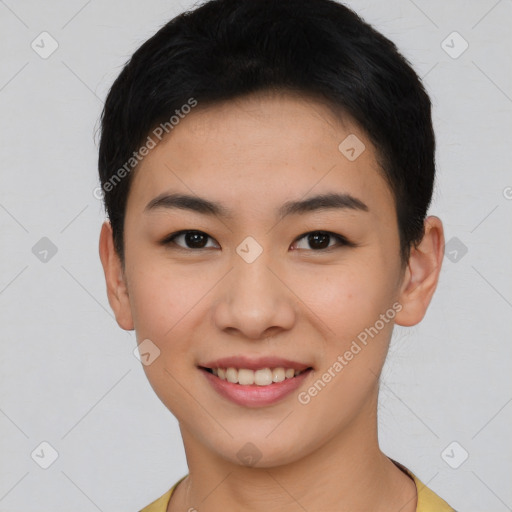 Joyful asian young-adult female with short  brown hair and brown eyes
