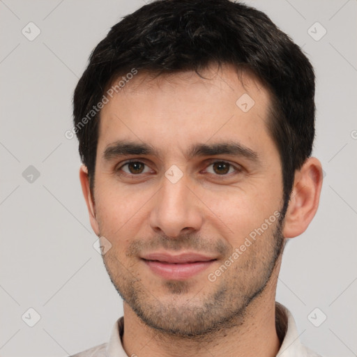 Joyful white young-adult male with short  black hair and brown eyes