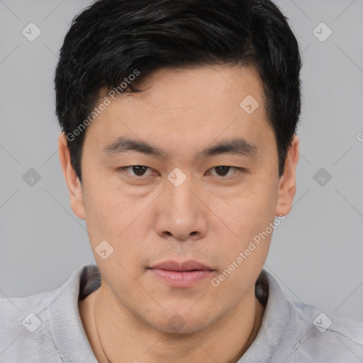 Neutral asian young-adult male with short  brown hair and brown eyes