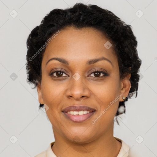 Joyful black adult female with short  brown hair and brown eyes