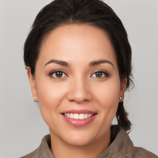 Joyful white young-adult female with medium  brown hair and brown eyes