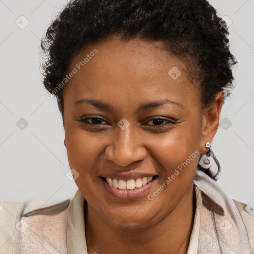 Joyful black young-adult female with short  brown hair and brown eyes