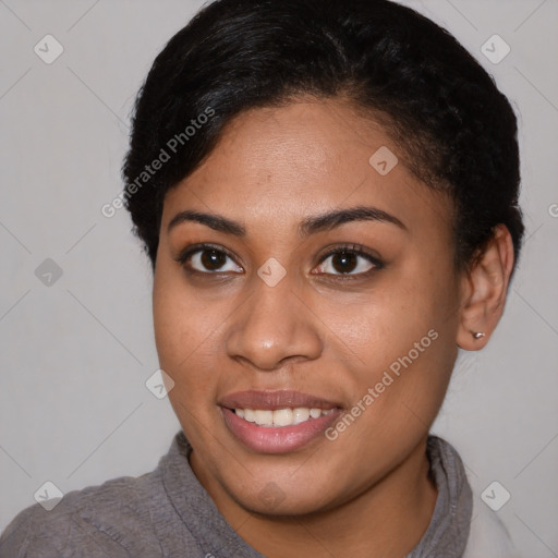 Joyful black young-adult female with short  brown hair and brown eyes