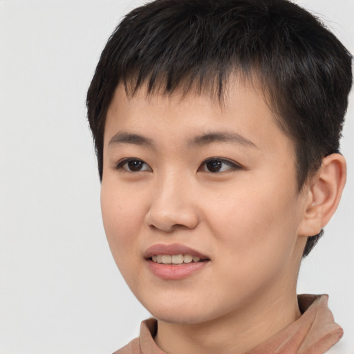 Joyful asian young-adult female with short  brown hair and brown eyes