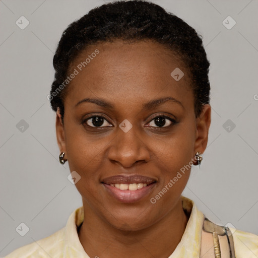 Joyful black young-adult female with short  brown hair and brown eyes