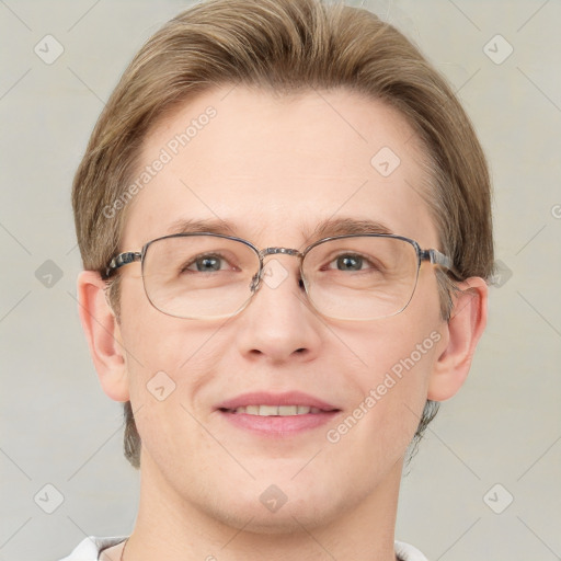 Joyful white adult male with short  brown hair and grey eyes