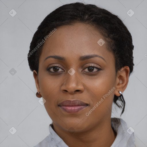 Joyful black young-adult female with short  black hair and brown eyes