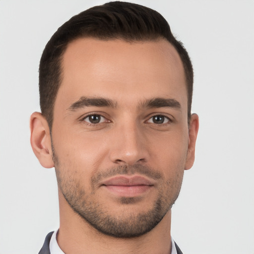 Joyful white young-adult male with short  brown hair and brown eyes