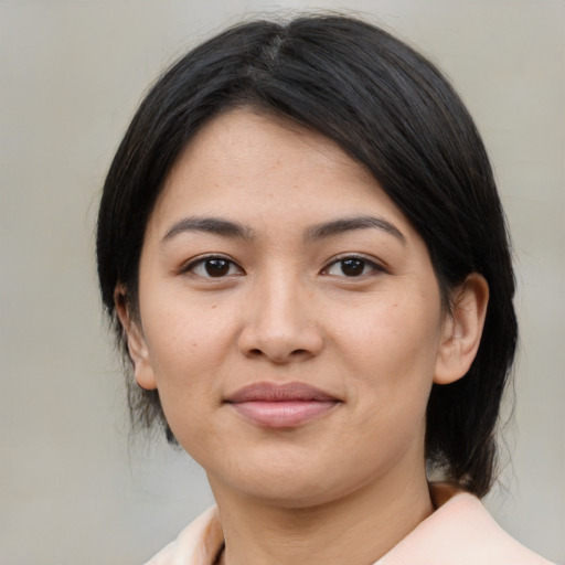 Joyful asian young-adult female with medium  black hair and brown eyes